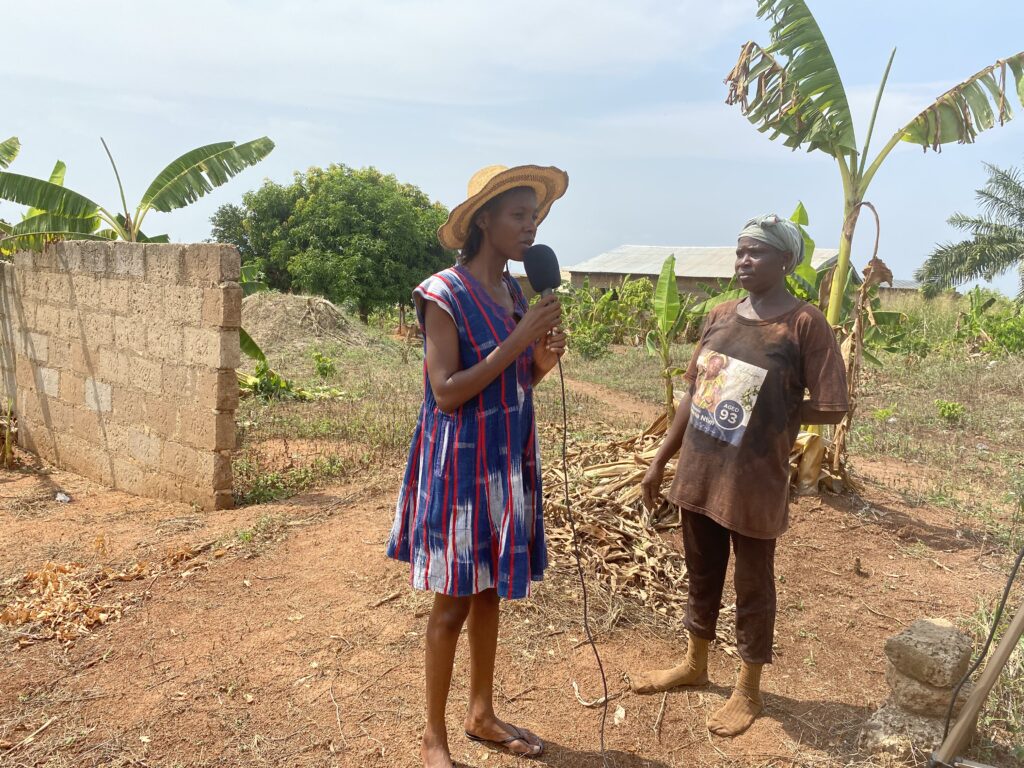 Two women farmers being interviewed on their land
